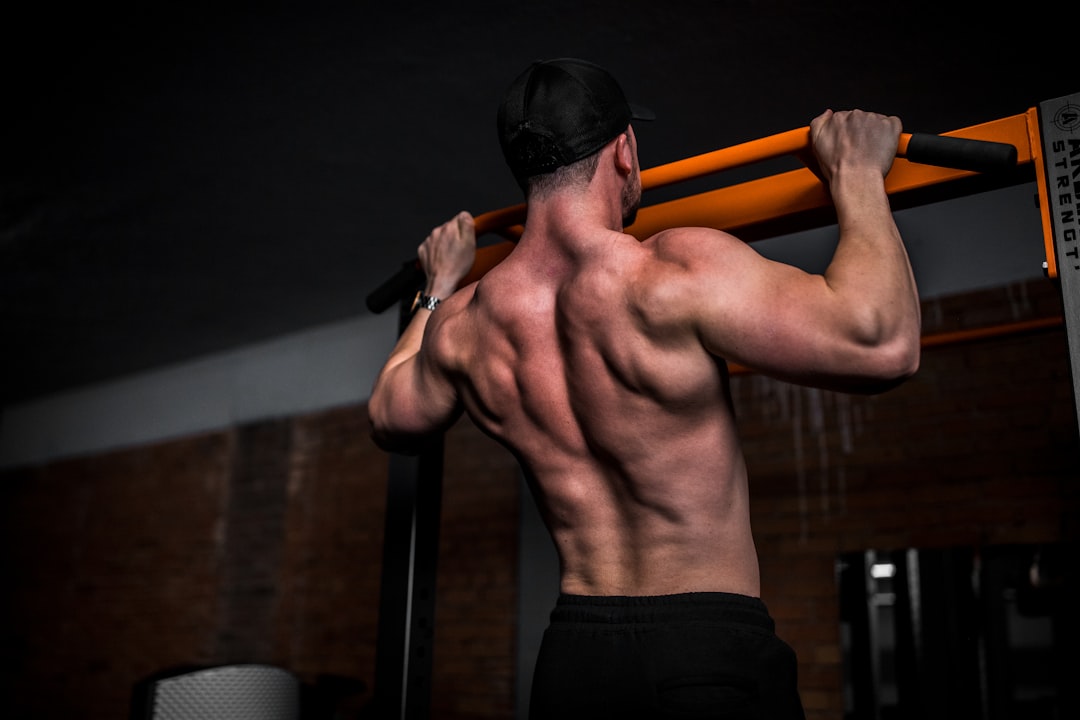 Man performing barbell compound exercise strength training