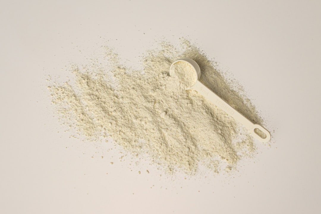 Creatine powder scoop measuring supplement dosage