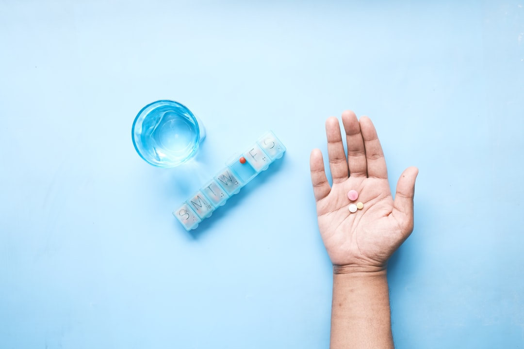 Person taking supplement vitamins for daily nutrition