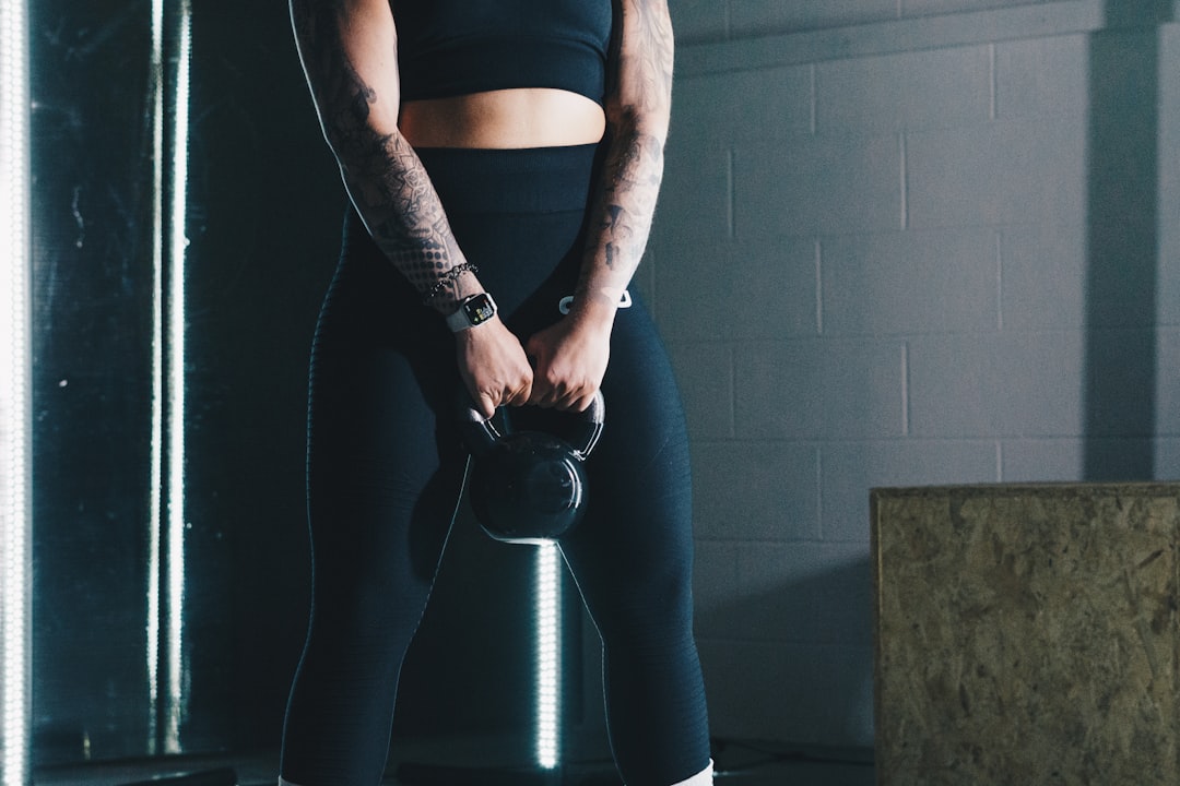 Suitcase carry with kettlebell training core stability and grip