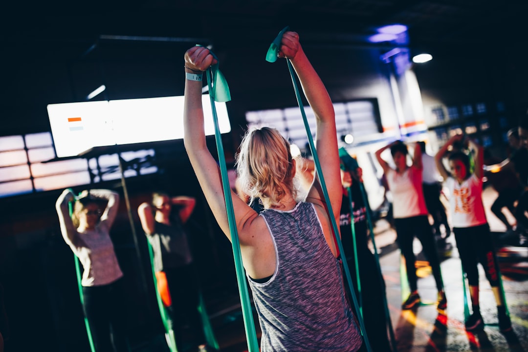 Group fitness class using resistance bands for exercise