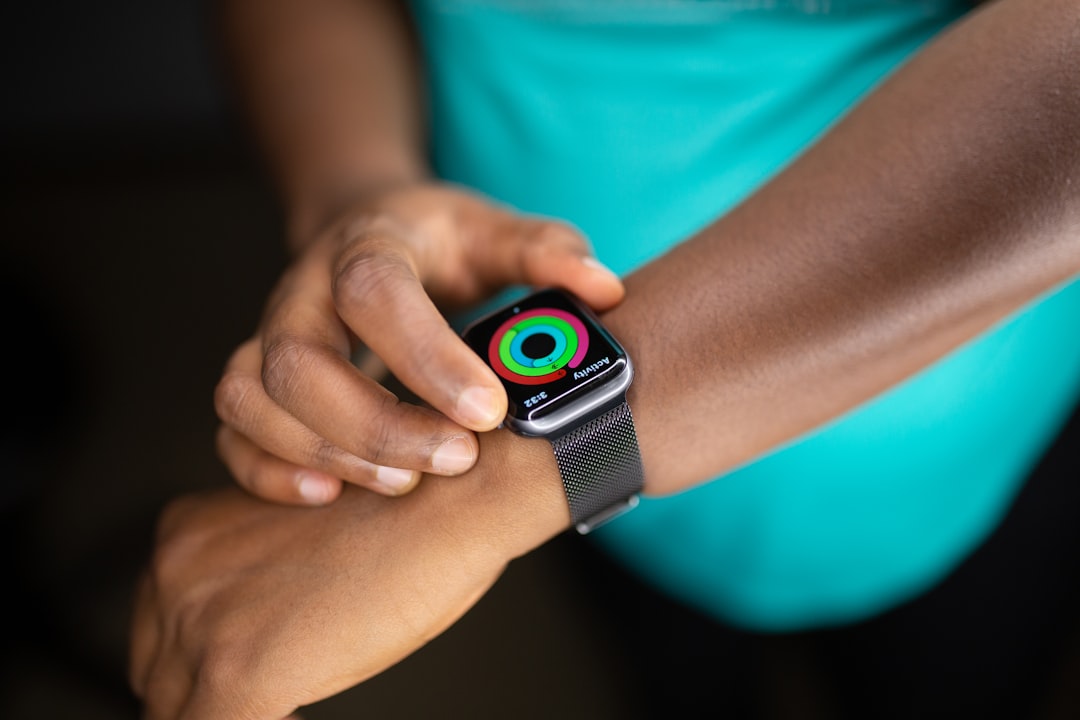Athlete checking smartwatch during running workout